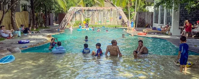Children and adults enjoying the pool at Beaver Club